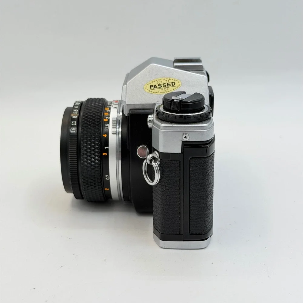 Olympus OM10 35mm Film SLR Camera with Zuiko Auto-S 50mm f1.8 Lens Silver Black